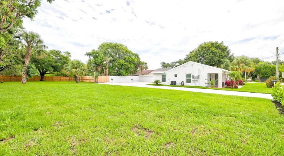 Completely remodeled quadruplex, with two duplex buildings and over half acre of land, partially fenced