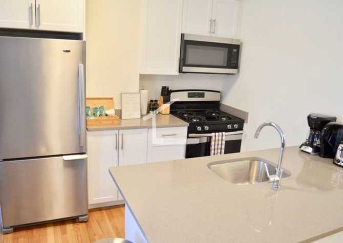 Apartments Near Top floor 2BR with private roof deck in South End Brownstone!