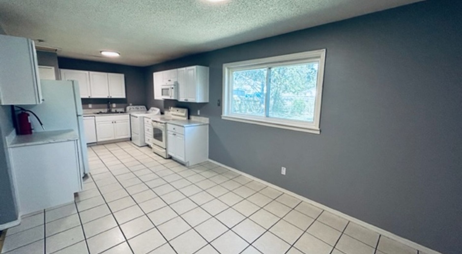 THREE BEDROOM/ONE BATH WITH SPACIOUS YARD AND MOVE IN SPECIAL!