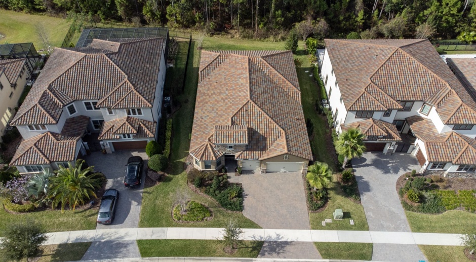 UNIQUE HOME WITH CONSERVATION at Enclave at Lake Nona. This gorgeous 3 bedroom, 3 bathroom home PLUS DEN + 3 cara garage