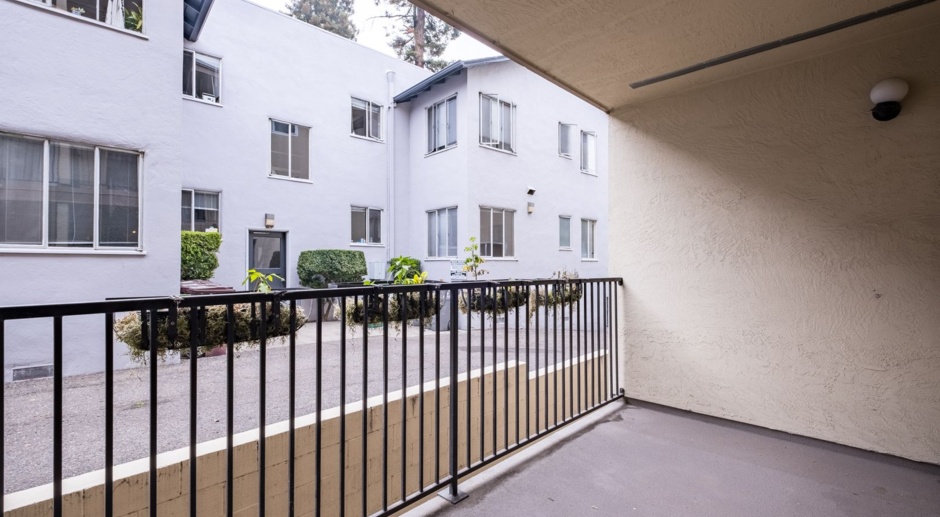 Modern 1 Bedroom Condo w/Secure Parking + EV Charger, Balcony, Laundry + MORE! 